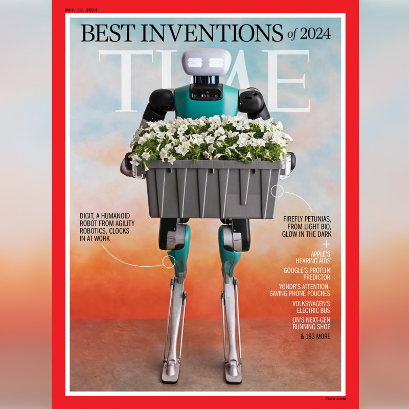 Front cover of November issue of TIME magazine. A robot is holding a tray of petunias.